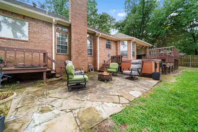 1408 Santa Fe Trl, Tyler, TX 75703 - rear view of house with an outdoor fire pit, a chimney, a patio, brick siding, and a wooden deck