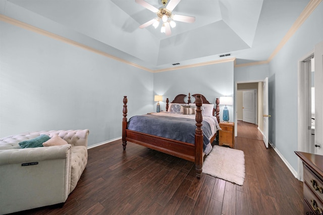 1408 Santa Fe Trl, Tyler, TX 75703 - bedroom with a tray ceiling, dark wood-type flooring, baseboards, ceiling fan, and crown molding