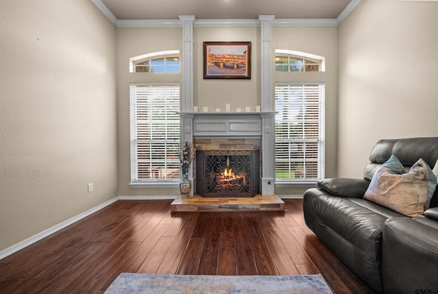 1408 Santa Fe Trl, Tyler, TX 75703 - living room featuring a warm lit fireplace, hardwood / wood-style floors, ornamental molding, and baseboards