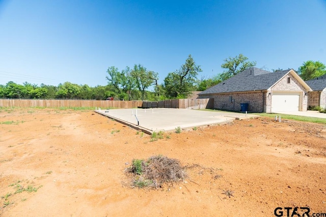 view of yard featuring a garage