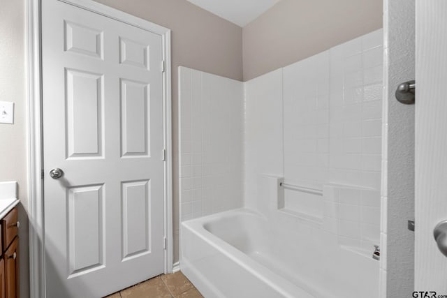 bathroom with shower / tub combination, tile patterned floors, and vanity