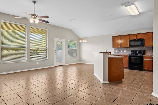 kitchen with black appliances, tile patterned flooring, decorative light fixtures, backsplash, and vaulted ceiling