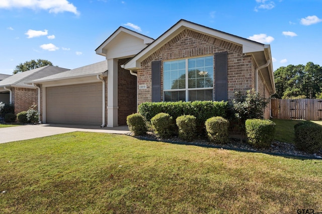 ranch-style house featuring a front lawn and a garage