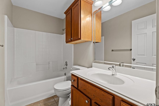 full bathroom with washtub / shower combination, tile patterned floors, toilet, and vanity