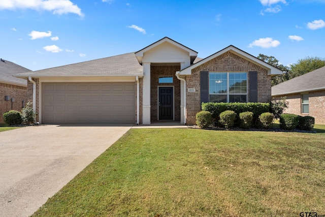 view of front of property with a front lawn and a garage