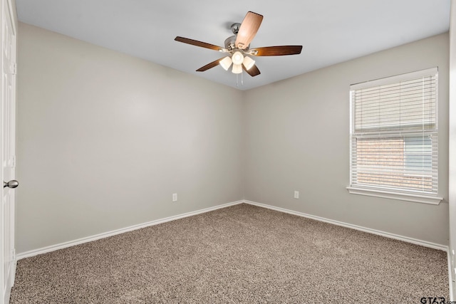 empty room featuring carpet floors and ceiling fan