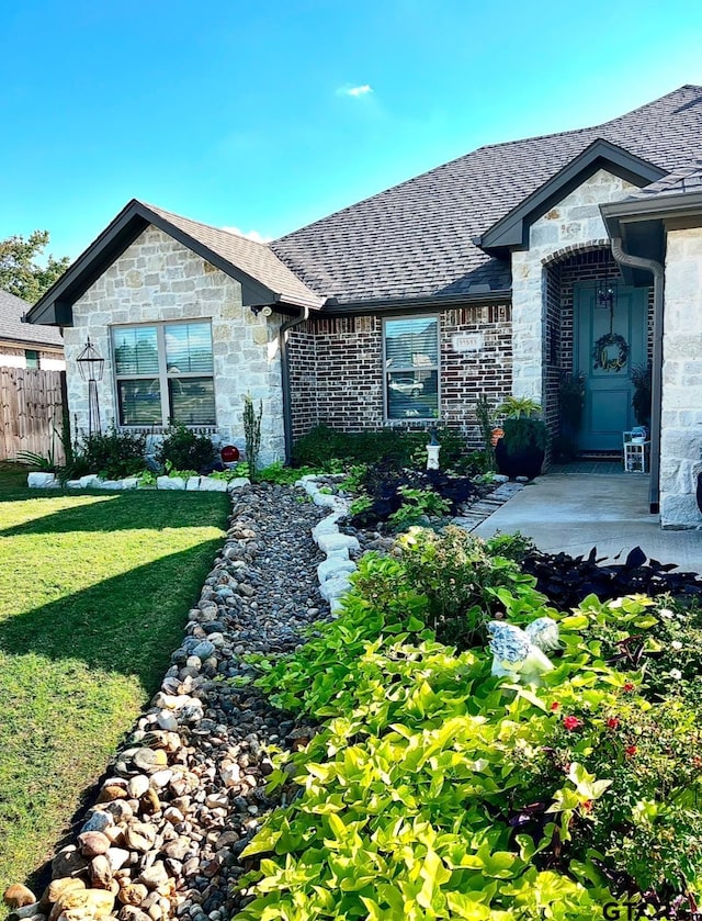 view of front of home with a front yard