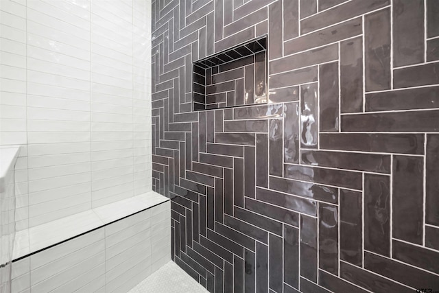 bathroom with a tile shower