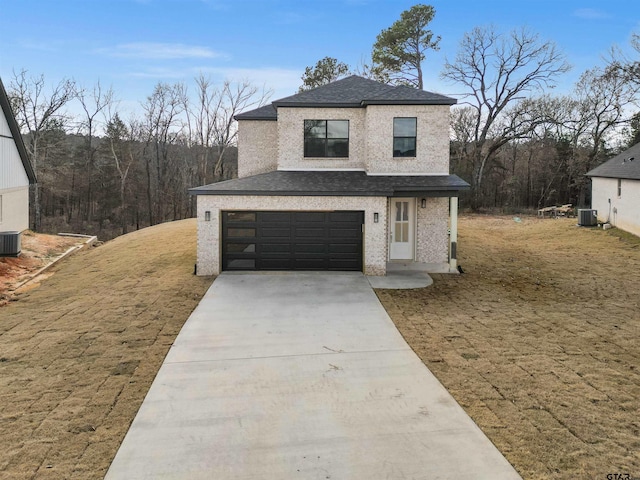 view of front of house featuring a front yard and a garage