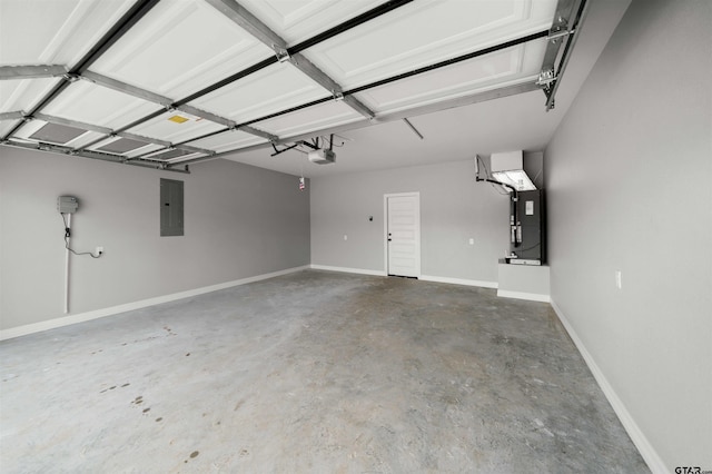 garage featuring a garage door opener, electric panel, and heating unit