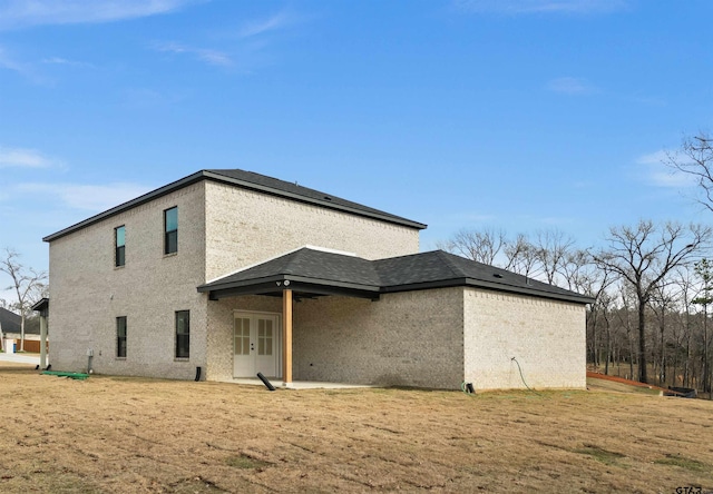 rear view of property with french doors