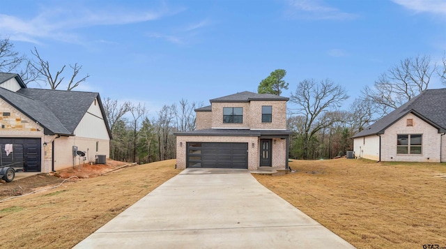 view of front of home featuring central AC, a garage, and a front lawn