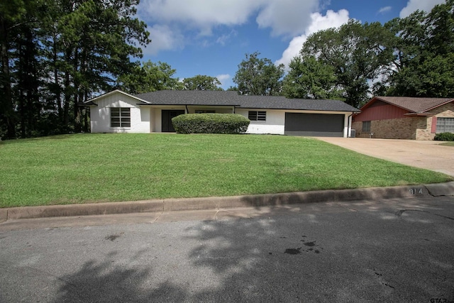 914 Neches Dr, Tyler, TX 75702 - single story home with a garage, concrete driveway, and a front lawn
