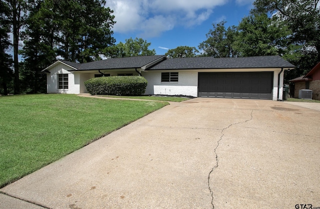 914 Neches Dr, Tyler, TX 75702 - ranch-style house featuring driveway, a garage, a front yard, roof with shingles, and brick siding