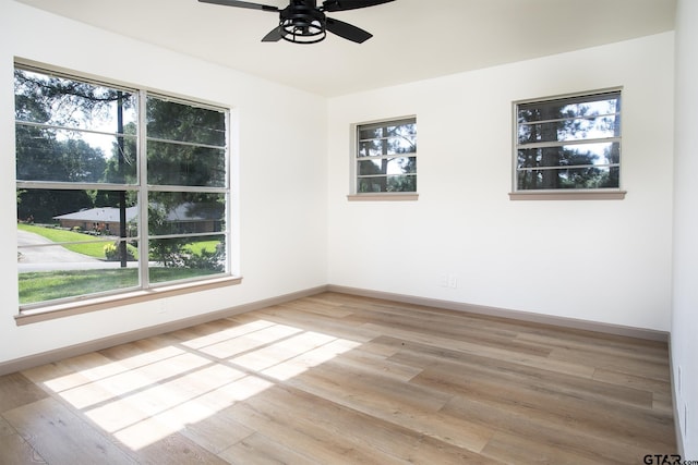 914 Neches Dr, Tyler, TX 75702 - unfurnished room with a ceiling fan, light wood-style flooring, and plenty of natural light