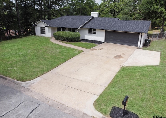 914 Neches Dr, Tyler, TX 75702 - ranch-style home featuring a shingled roof, an attached garage, driveway, a chimney, and view of wooded area