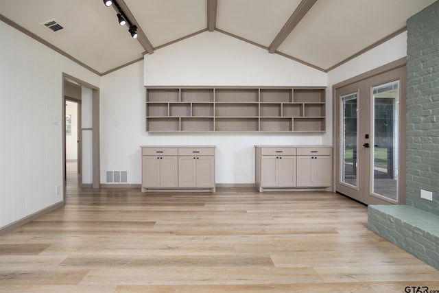 914 Neches Dr, Tyler, TX 75702 - interior space featuring light wood-style floors, french doors, and rail lighting