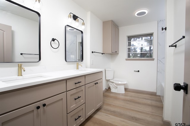 914 Neches Dr, Tyler, TX 75702 - bathroom with double vanity and wood finished floors