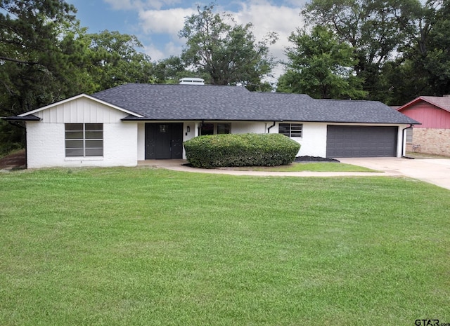 914 Neches Dr, Tyler, TX 75702 - single story home with an attached garage, concrete driveway, a front lawn, and roof with shingles
