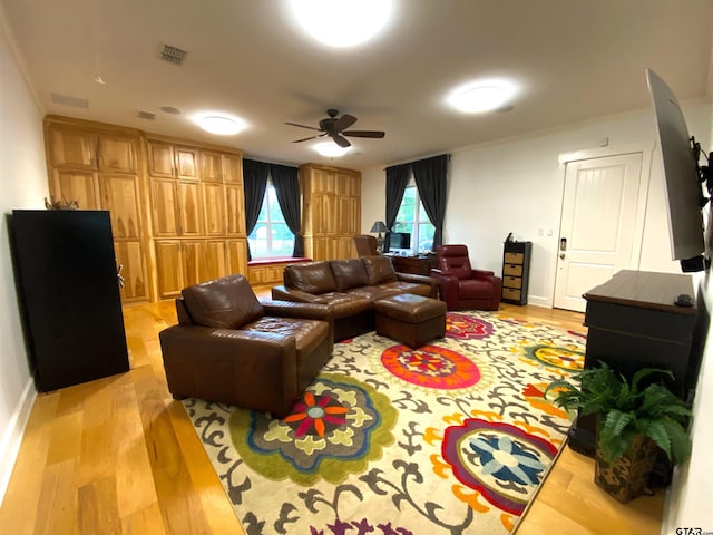 living room featuring light wood-type flooring and ceiling fan