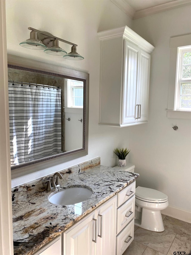 bathroom with curtained shower, vanity, crown molding, tile patterned floors, and toilet