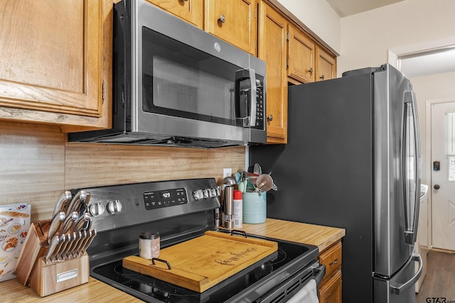 169 Phil Dr, Hawkins, TX 75765 - kitchen with decorative backsplash and stainless steel appliances