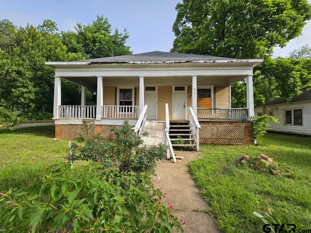823 W Louisiana St, Palestine, TX 75801 - view of front of house with covered porch, a front yard, and stairway