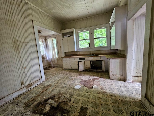 823 W Louisiana St, Palestine, TX 75801 - kitchen featuring white cabinetry and a sink