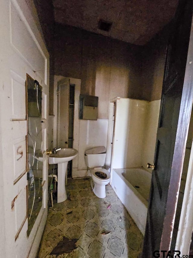 823 W Louisiana St, Palestine, TX 75801 - bathroom featuring tile patterned floors and toilet