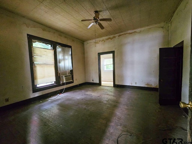 823 W Louisiana St, Palestine, TX 75801 - empty room featuring a ceiling fan, wood-type flooring, and cooling unit