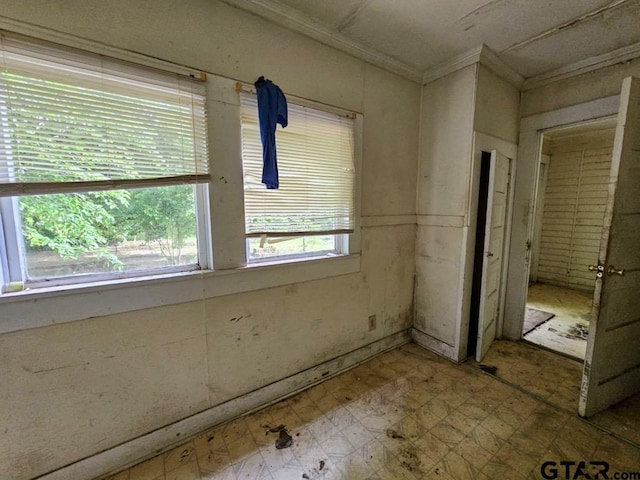 823 W Louisiana St, Palestine, TX 75801 - spare room with ornamental molding and tile patterned floors