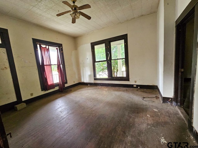 823 W Louisiana St, Palestine, TX 75801 - empty room featuring wood-type flooring, healthy amount of natural light, and a ceiling fan