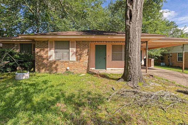 3131 Greg Ln, Tyler, TX 75701 - view of front of home with brick siding, an attached carport, and concrete driveway