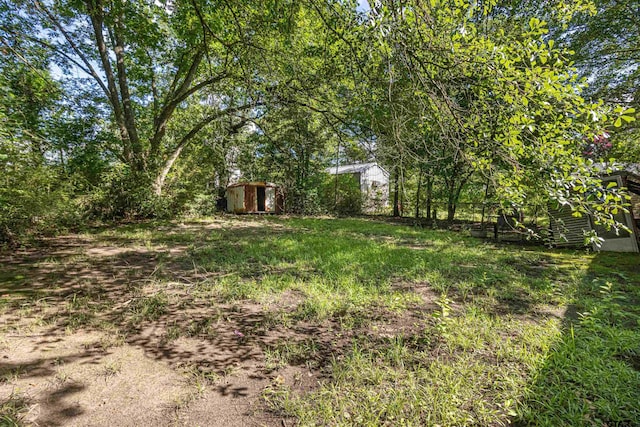 3131 Greg Ln, Tyler, TX 75701 - view of yard with a storage shed