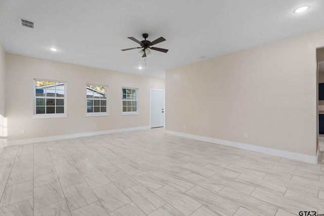 empty room featuring ceiling fan