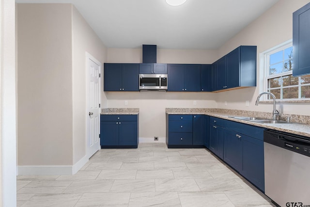 kitchen featuring blue cabinetry, sink, and stainless steel appliances