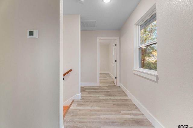 corridor featuring light hardwood / wood-style floors