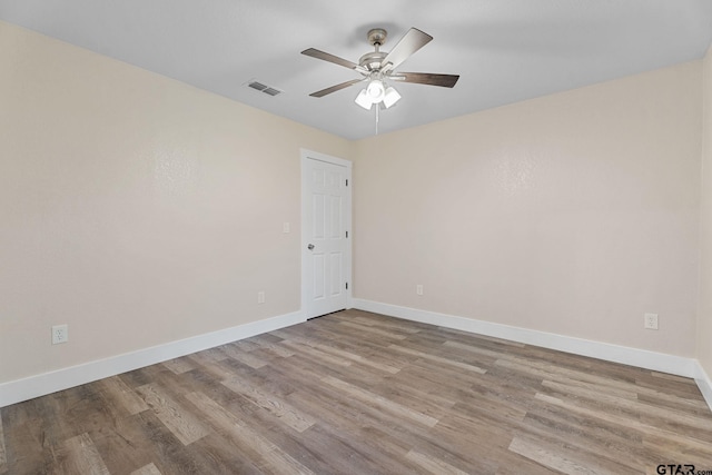 unfurnished room featuring ceiling fan and light wood-type flooring