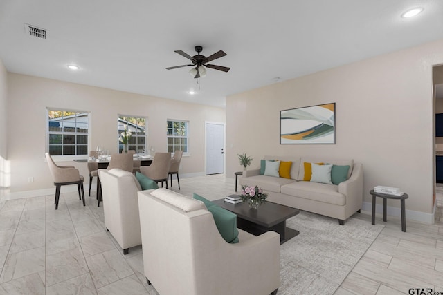 living room featuring ceiling fan