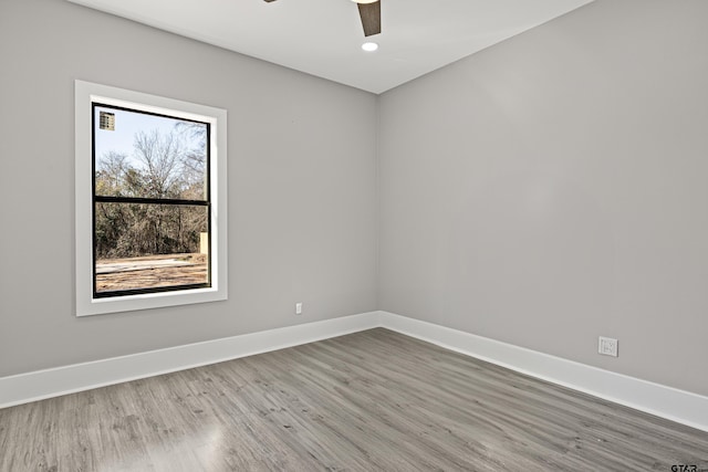 unfurnished room featuring hardwood / wood-style floors and ceiling fan