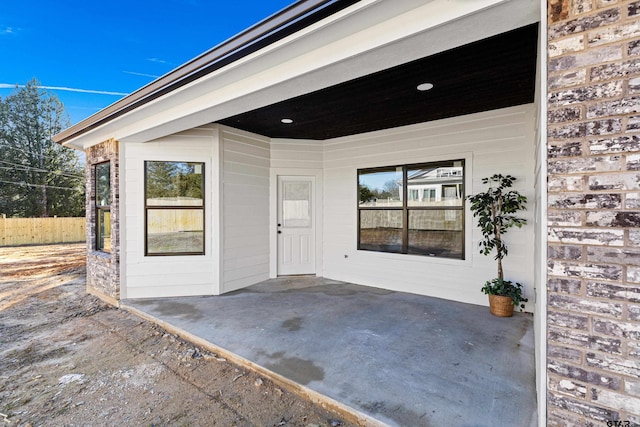 property entrance with a patio area