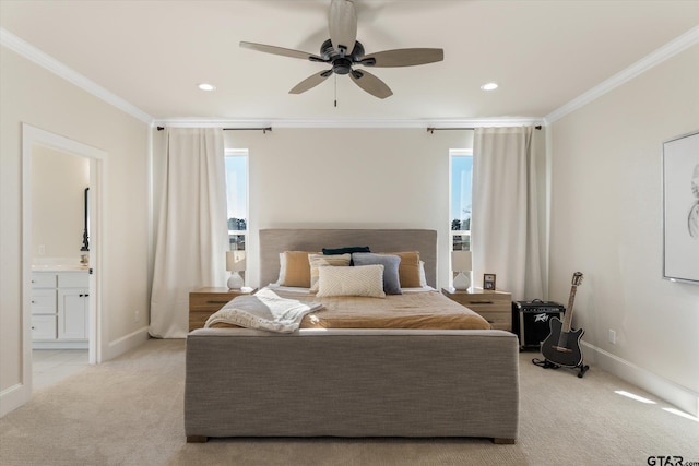 carpeted bedroom with connected bathroom, ceiling fan, and crown molding