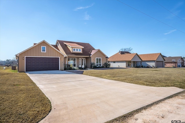 view of front facade featuring a garage and a front lawn