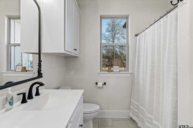 bathroom featuring tile patterned floors, a wealth of natural light, and vanity