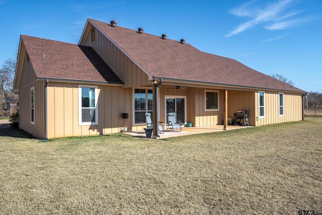 back of house featuring a patio area and a yard