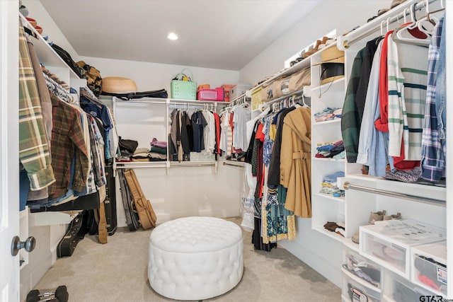 spacious closet with light colored carpet