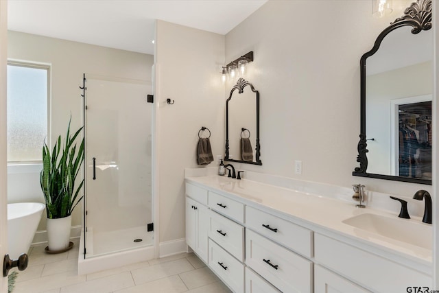 bathroom featuring tile patterned floors, vanity, and separate shower and tub