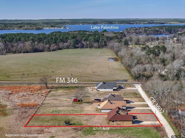 drone / aerial view featuring a rural view and a water view