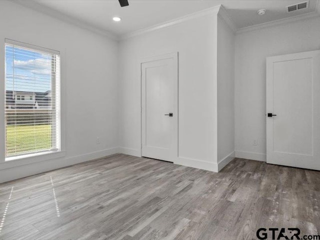 12237 Harlon St, Flint, TX 75762 - spare room featuring ornamental molding, baseboards, visible vents, and wood finished floors