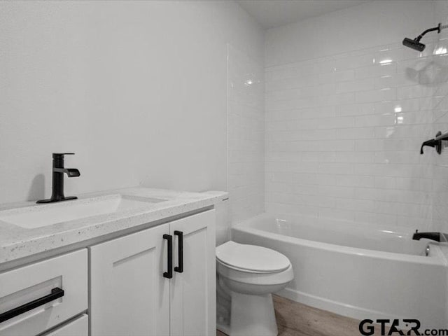 12237 Harlon St, Flint, TX 75762 - bathroom featuring toilet, wood finished floors, vanity, and shower / tub combination